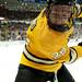 Michigan Tech defenseman Walker Hyland digs the puck out of the corner at Joe Louis Arena on Saturday, Dec. 29. Daniel Brenner I AnnArbor.com